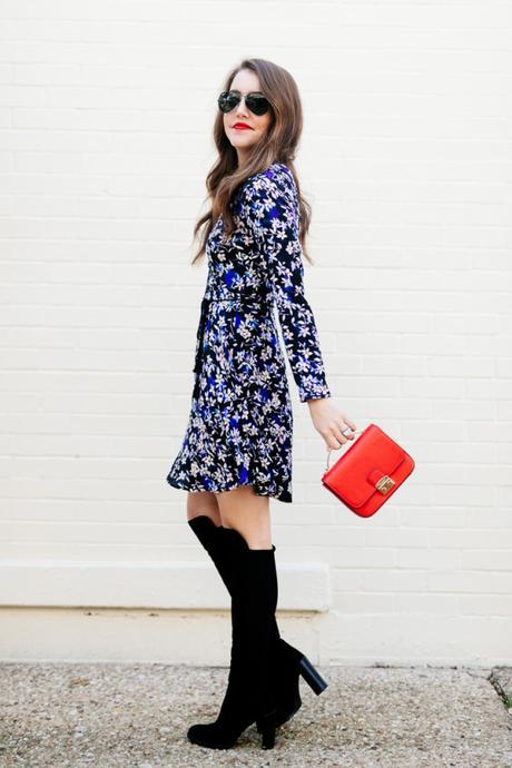 Amy Havins wears a blue floral print Shoshanna dress with Stuart Weitzman over the knee boots.