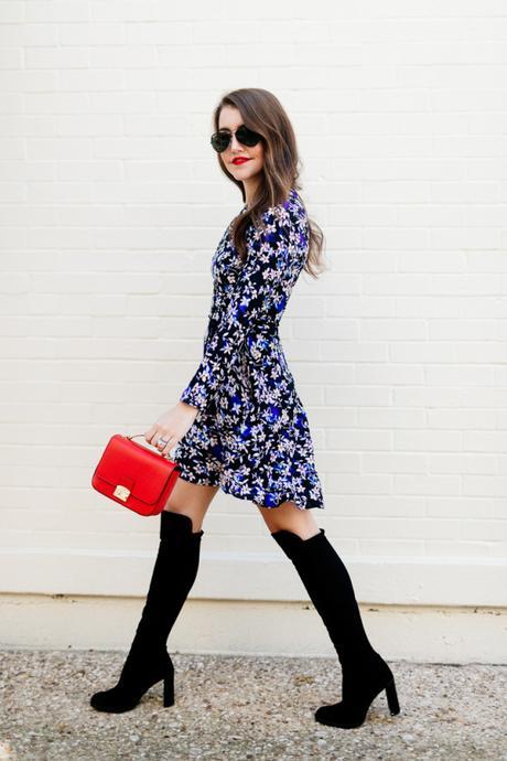 Amy Havins wears a blue floral print Shoshanna dress with Stuart Weitzman over the knee boots.