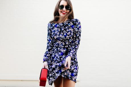 Amy Havins wears a blue floral print Shoshanna dress with Stuart Weitzman over the knee boots.