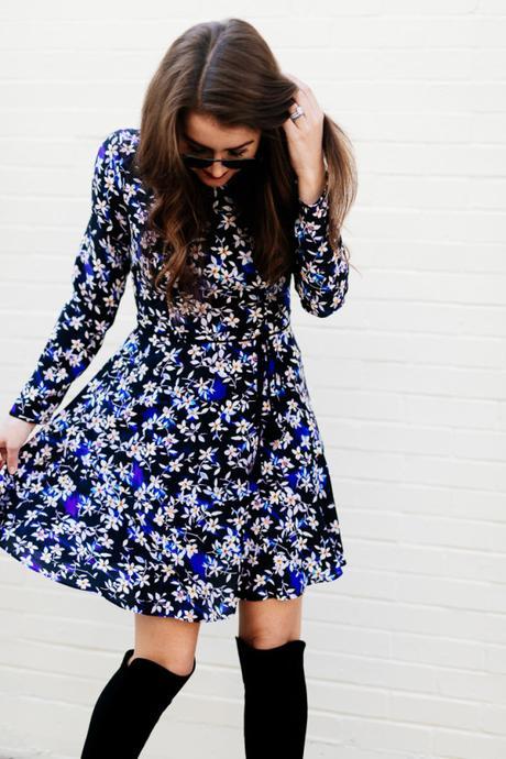 Amy Havins wears a blue floral print Shoshanna dress with Stuart Weitzman over the knee boots.