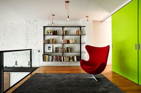 Renovated DC Row House loft space with Arne Jacobsen Egg Chair.
