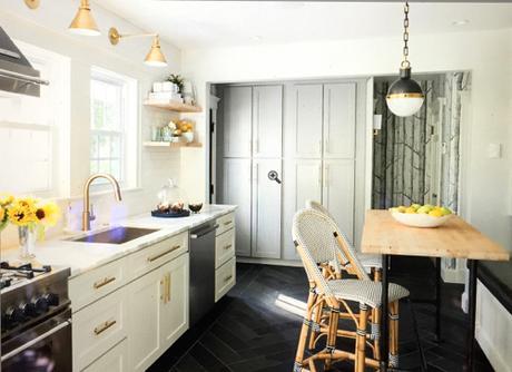 Brass Sconces And Hardware in Kitchen With Black Floor
