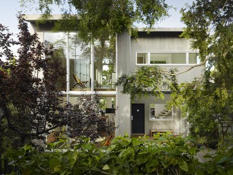 A third floor addition and whole-house renovation modernized a funky cottage on an unusual, triple-wide lot in San Francisco.