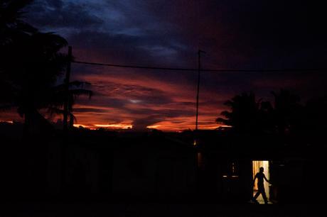 One of my favourites. From Dehiwala station, the person is actually opening a door to a hut in the shanty town next to the station.