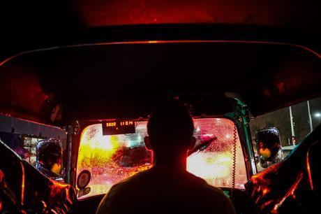 A 3-wheeler ride home on a very rainy evening. The brake lights lit up the entire inside of the 3-wheeler. This was the day of my ebook release, fittingly the 3-wheeler looks like a nightclub! Fujifilm X-Pro2.