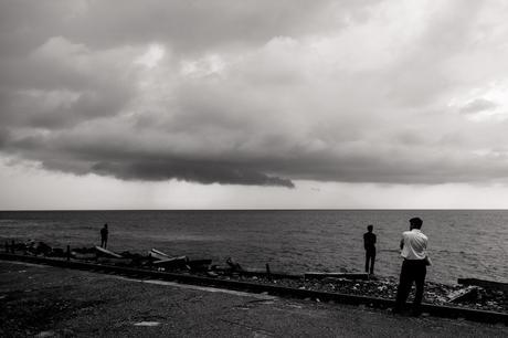 People waiting for the train while another storm threatens.