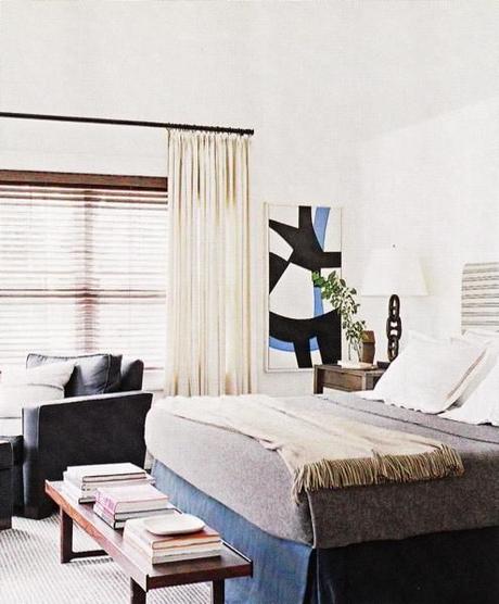 Blue And White Bedroom With Abstract Artwork