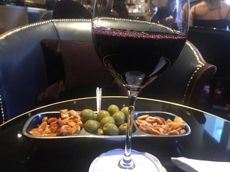 Have a glass of wine in the American bar at The Savoy Hotel