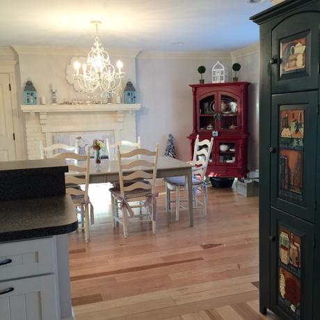 OUR SPACE—While the red hutch is very pretty, I think turning into a pretty turquoise is going to look great in the room. With colors such as grey, white, and black to anchor the room, a pop of turquoise may be just what the Kitchen Renovation Doctor ordered.