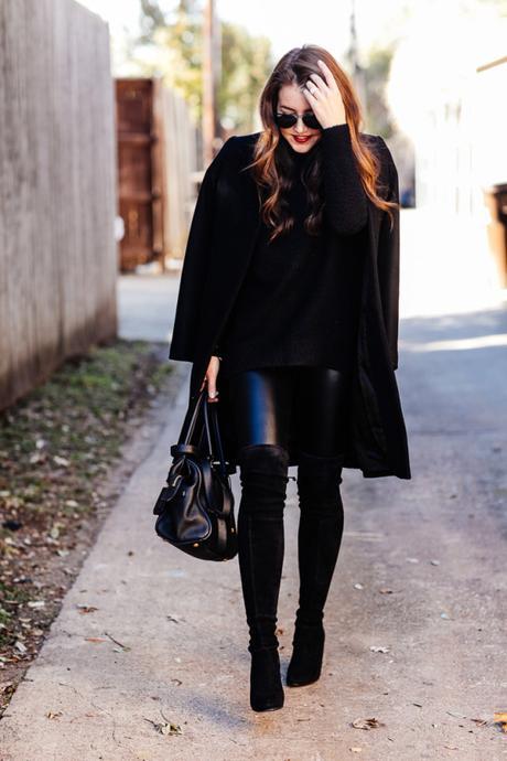 Amy Havins wears an all black look paired with faux leather leggings.