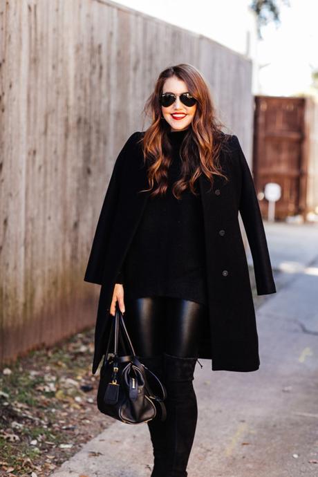 Amy Havins wears an all black look paired with faux leather leggings.