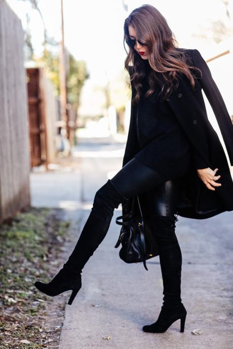 Amy Havins wears an all black look paired with faux leather leggings.