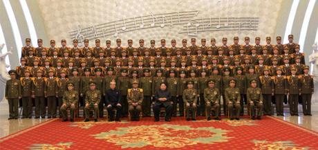 Kim Jong Un Attends Anniversary Concert of KPA Military Band Kim Jong Un poses for a commemorative photograph with musicians and other personnel of the KPA Military Band, after a concert marking its 70th anniversary (Photo: Rodong Sinmun).