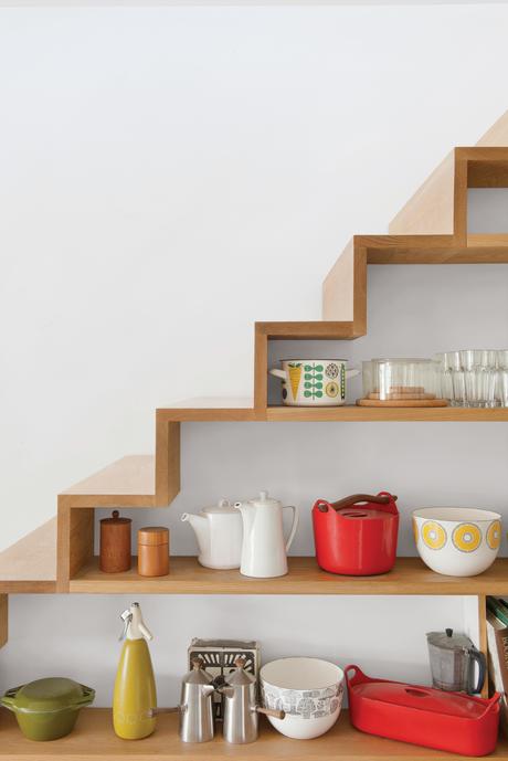 Wooden staircase with kitchen shelves 