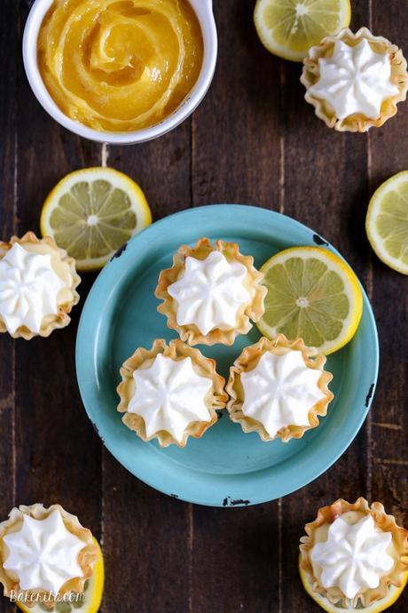 These Lemon Cream Pie Bites may be tiny, but they're bursting with bright lemon flavor. Lemon curd and whipped cream are the stars of these bite-sized pies - no baking required!