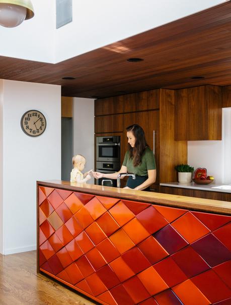 Red tiles brighten up the kitchen and provides views throughout the house.