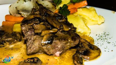 Filet and mushrooms over potatoes at Pappardeles in Banos Ecuador