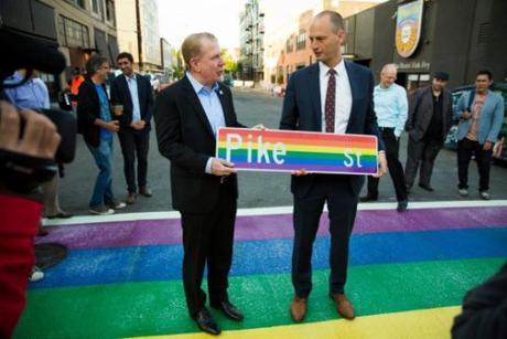 Seattle Mayor Ed Murray (l) standing on a rainbow sidewalk that will fight crime.