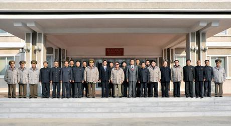 A commemorative photograph of late DPRK leader Kim Jong Il and Kim Jong Un at T'aeso'ng Machine Factory with factory managers, senior Korean People's Army [KPA] and WPK officials in November 2011 (Photo: NK Leadership Watch file photo/KCNA).