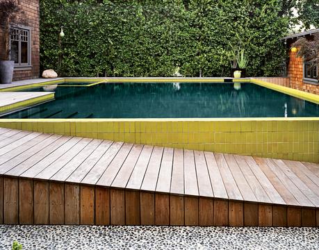 Tiled pool with descending wood plank