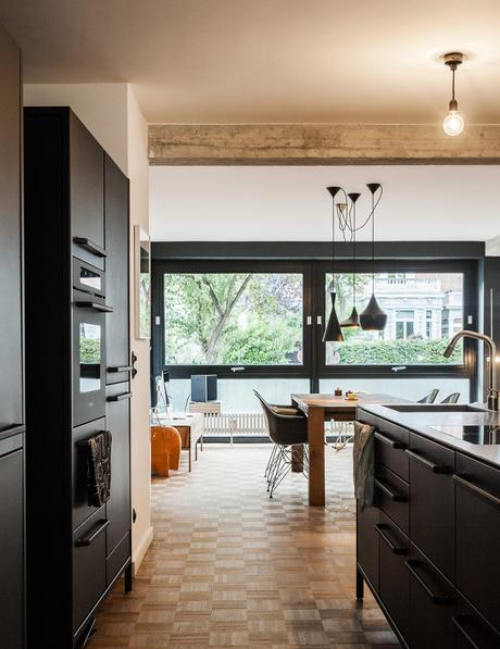 Vipp kitchen, Bigfoot table from e15, and vintage Eames shell chairs.