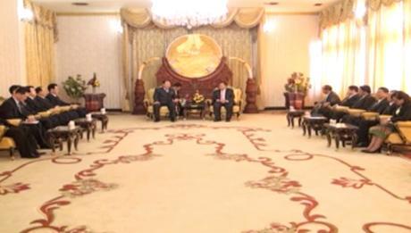 Minister of People's Security Choe Pu Il (background, L) and a delegation of Ministry of People's Security meet with Lao People's Revolutionary Party General-Secretary 