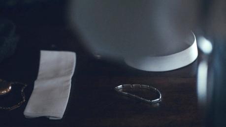 Peaky Blinders – Tommy’s Gray Striped Flannel Suit Tommy's pocket square, sleeve garter, and collar are laid out before his big day at the races.