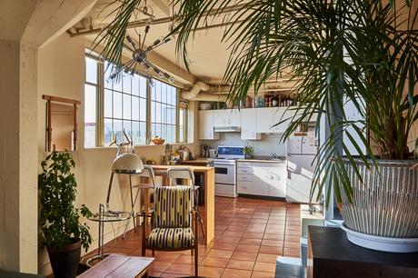 Eclectic kitchen in home of two artists, located in a Vancouver warehouse.