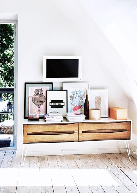 TV In a Gallery Wall Over A Floating Wood Credenza