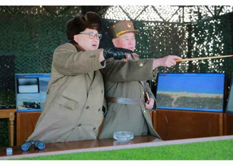 Kim Jong Un Commands and Observes Landing and Anti-Landing Drills Kim Jong Un is briefed about a landing and anti-landing drill. Also in attendance is Chief of the KPA General Staff General Ri Myong Su (Photo: Rodong Sinmun).