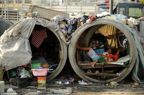 poor of Manila, Phillipines live in make shift homes inside concrete pipes ... and Madras  !!