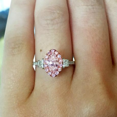 Fancy pink diamond halo engagement ring