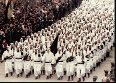 The Al-Quada-linked 'El-Mujahedeen' brigade of the Bosnian Muslim Army parading in downtown Zenica in central Bosnia in 1995, carrying the black flag of Islamic jihad