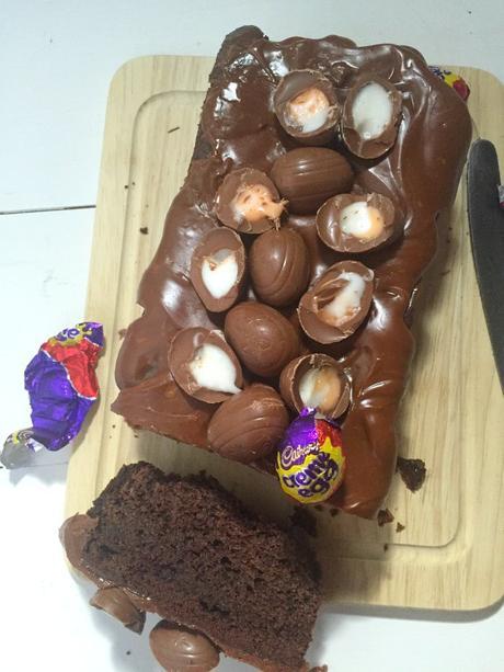 Fudgy, rich chocolate loaf cake topped with a chocolate glaze and Cadbury Creme Eggs. Easy, quick and simple to make! Creme Egg Chocolate Loaf Cake 