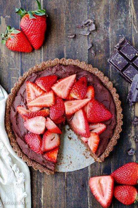 This Strawberry Chocolate Tart has whipped chocolate ganache made with coconut cream in a gluten-free chocolate crust, topped with fresh strawberries. Slice into this easy and delicious vegan, gluten-free, and Paleo dessert.