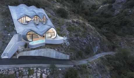 Spanish home embedded in hillside.