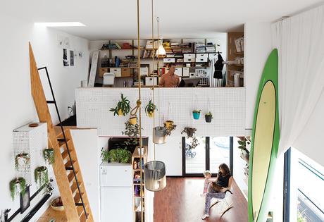 Modern micro-living, live-work unit with pegboard mezzanine