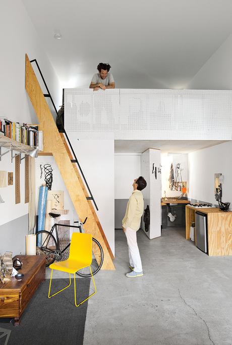 Modern micro-living unit with a pegboard mezzanine 