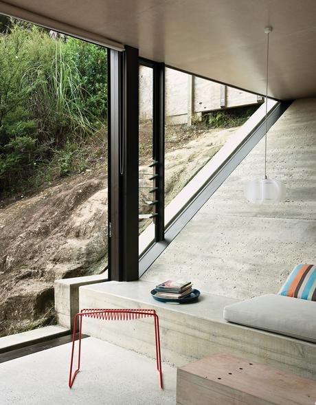 Living room with modern furniture and concrete flooring