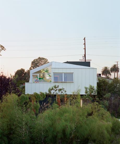 From the deck off the master bedroom, Eric Grunbaum looks across his front yard. Barbara Bestor designed the second story to float over the ground “like a cloud.”