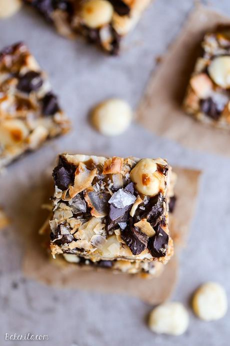 These Dark Chocolate Macadamia Nut Magic Bars are a sweet & gooey dessert bar with a hint of tropical flair. You'll be hooked after one bite of the gooey vegan caramel and buttery macadamia nuts on a gluten-free coconut lime crust.