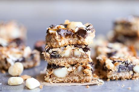 These Dark Chocolate Macadamia Nut Magic Bars are a sweet & gooey dessert bar with a hint of tropical flair. You'll be hooked after one bite of the gooey vegan caramel and buttery macadamia nuts on a gluten-free coconut lime crust.