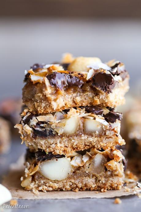 These Dark Chocolate Macadamia Nut Magic Bars are a sweet & gooey dessert bar with a hint of tropical flair. You'll be hooked after one bite of the gooey vegan caramel and buttery macadamia nuts on a gluten-free coconut lime crust.