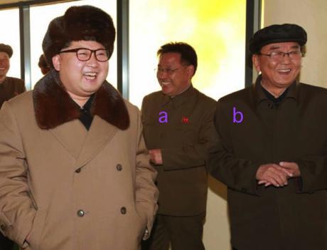 Kim Jong Un at the engine test, accompanied by WPK Military Industry Department deputy director Kim Jong Sik (a) and WPK Military Industry Department Director Ri Man Gon (b) (Photo: Rodong Sinmun).