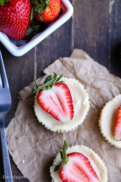 These Greek Yogurt Cheesecakes are smooth and creamy with a bit of tanginess and a crunchy granola crust. These gluten-free cheesecakes were delicious for breakfast topped with fresh berries, and they're only 177 calories each!