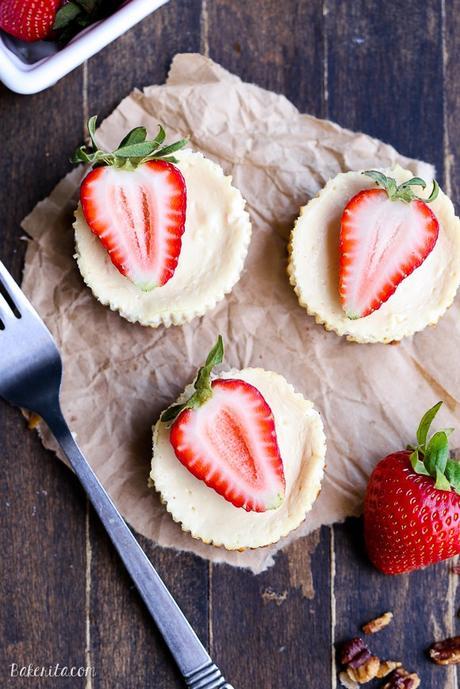 These Greek Yogurt Cheesecakes are smooth and creamy with a bit of tanginess and a crunchy granola crust. These gluten-free cheesecakes were delicious for breakfast topped with fresh berries, and they're only 177 calories each!