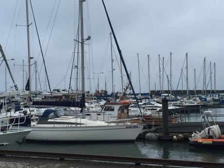 Eat haddock and chips from Anstruther fish bar whilst overlooking fishing boats