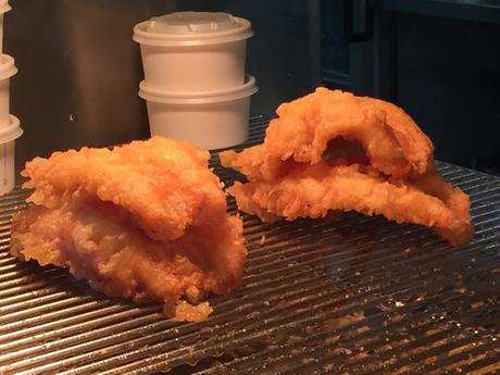 Eat haddock and chips from Anstruther fish bar whilst overlooking fishing boats