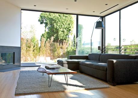Urban living room with tall glass windows 
