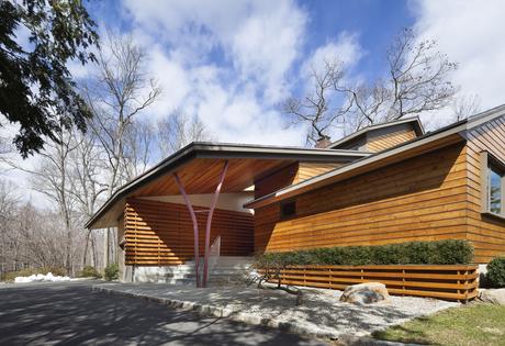 Steel beams reference the surrounding woods in upstate New York